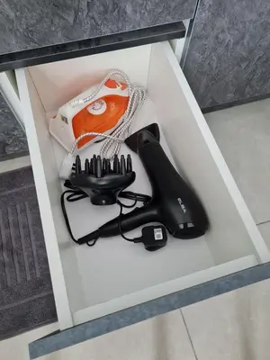 a box with a hair dryer and a blow dryer at Stylish Studio Neu Suites 10 mins to KLCC in Kuala Lumpur