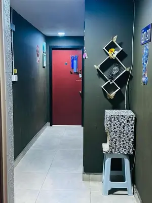 a room with a red door and a chair in it at Day Cocoon In City Kuala lumpur in Kuala Lumpur