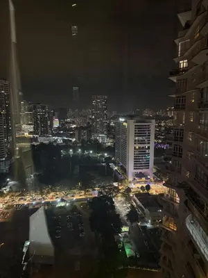 a city lit up at night with traffic at Day Cocoon In City Kuala lumpur in Kuala Lumpur