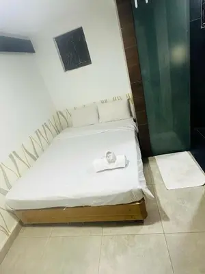 a bed with a towel on it in a room at Day Cocoon In City Kuala lumpur in Kuala Lumpur