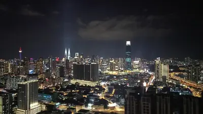a view of a city at night at Homestay at Trion KL in Kuala Lumpur