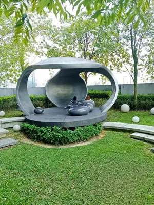 a sculpture of a vase in a park at SafeHouse At Scarletz Suite KLCC in Kuala Lumpur