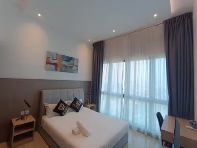 a bedroom with a bed and a large window at The Luxe Colony By Kuala Lumpur Homestay in Kuala Lumpur