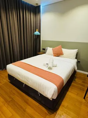 a bedroom with a large bed in a room at Sky suites klcc stay Comfortable in Kuala Lumpur