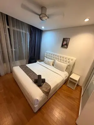 a bedroom with a large white bed in a room at Kuala-lumpur City View Vortex Apartment in Kuala Lumpur