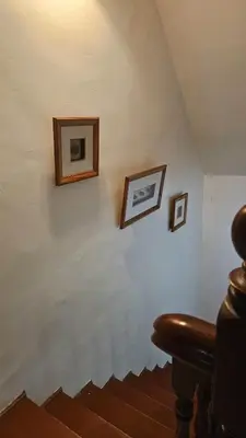 a room with three framed pictures on a wall at Cozy Private Room in Taman Desa with Shared Bathroom in Kuala Lumpur