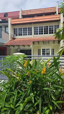 a building with a bush in front of it at Cozy Private Room in Taman Desa with Shared Bathroom in Kuala Lumpur