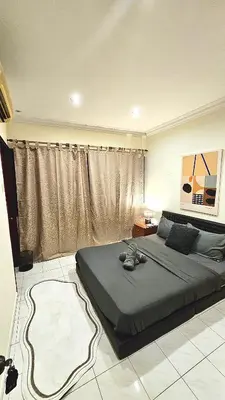 a bedroom with a bed and a large window at Cozy 2 Private Rooms in Taman Desa with Shared Bathroom in Kuala Lumpur