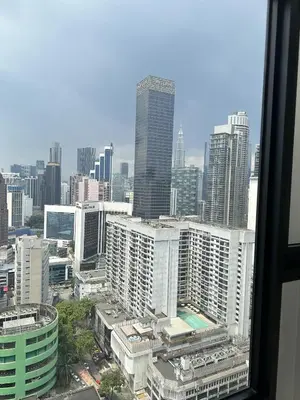 a view of a city skyline with tall buildings at Axon Suites near at Pavilion with Rooftop Panoramic City View in Kuala Lumpur