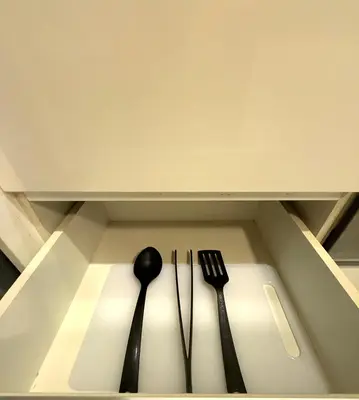 two utensils and a spoon and fork in a drawer at CozyHome Suites Casa Mutiara in Kuala Lumpur