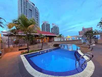 a large swimming pool in the middle of a city at CozyHome Suites Casa Mutiara in Kuala Lumpur