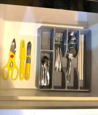 a tray filled with utensils on a shelf at CozyHome Suites Casa Mutiara in Kuala Lumpur