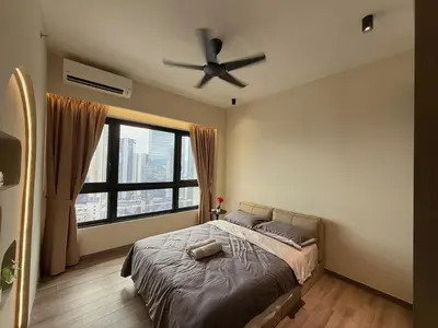 a bedroom with a bed with a ceiling fan at 5PX Comfy 2BR Agile Bukit Bintang Walkable Pavilion, TRX & MRT in Kuala Lumpur