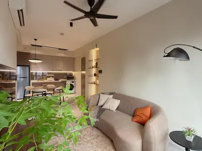 a living room with a couch and a ceiling fan at 5PX Comfy 2BR Agile Bukit Bintang Walkable Pavilion, TRX & MRT in Kuala Lumpur