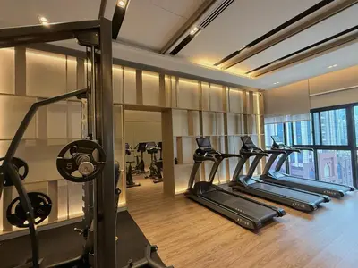 a gym with several treadmills and ellipticals at 5PX Comfy 2BR Agile Bukit Bintang Walkable Pavilion, TRX & MRT in Kuala Lumpur
