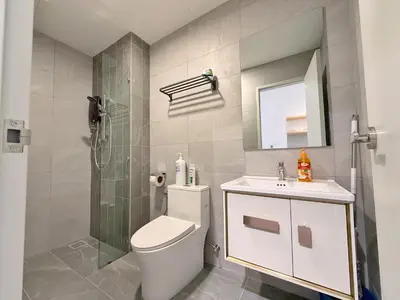 a bathroom with a toilet and a sink and a shower at Majestic Charming Studio Suite with Infinity Pool in Kuala Lumpur
