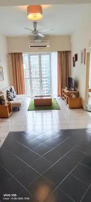 a living room with a large room with a large window at Greenstone suites at Seri Bukit Ceylon in Kuala Lumpur