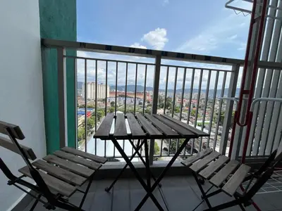 a table and two chairs sitting on a balcony at Ampang 2pax Studio Ampang Point in Ampang