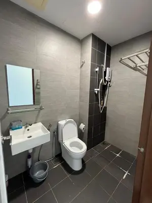 a bathroom with a toilet and a sink at Ampang 2pax Studio Ampang Point in Ampang