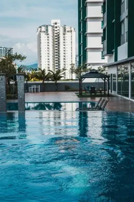 a swimming pool in a city with tall buildings at Ampang 2pax Studio Ampang Point in Ampang