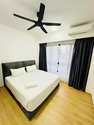 a bedroom with a white bed with a ceiling fan at Agile Delima Sky View Apartment at TRX Bukit Bintang in Kuala Lumpur
