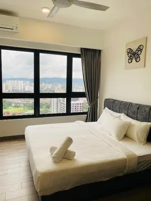 a bedroom with a bed with a large window at Agile Bukit Bintang Homestay KLCC in Kuala Lumpur