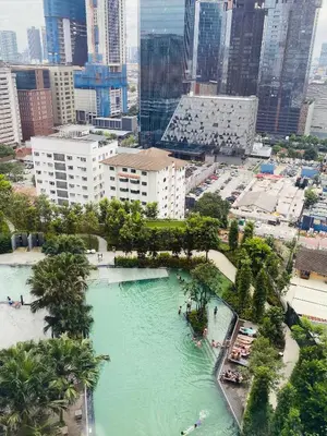 an aerial view of a large pool of water in a city at Agile Bukit Bintang Homestay KLCC in Kuala Lumpur