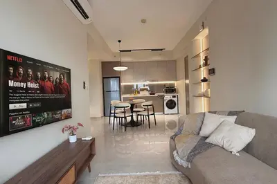 a living room with a couch and a kitchen at 3PX Deluxe Suites Agile Bukit Bintang, Walkable Pavilion & TRX & MRT in Kuala Lumpur