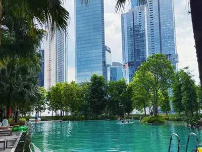 a swimming pool in a city with tall buildings at 3PX Deluxe Suites Agile Bukit Bintang, Walkable Pavilion & TRX & MRT in Kuala Lumpur