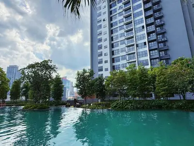 a large pool of water in front of a tall building at 3PX Deluxe Suites Agile Bukit Bintang, Walkable Pavilion & TRX & MRT in Kuala Lumpur