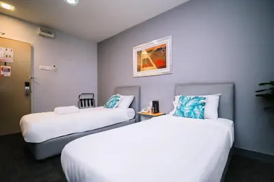 a hotel room with two beds in a room at iBilik - Velocity Kuala Lumpur in Kuala Lumpur