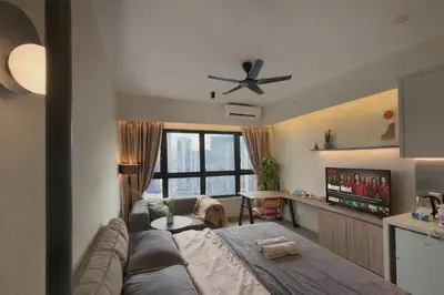 a living room with a couch and a ceiling fan at 2PX Comfy Suite, Agile Bukit Bintang Near TRX, Pavilion, MRT TRX in Kuala Lumpur