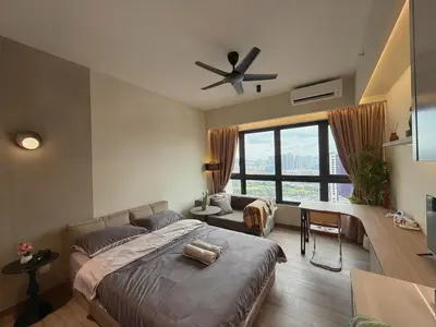 a bedroom with a bed and a ceiling fan at 2PX Comfy Suite, Agile Bukit Bintang Near TRX, Pavilion, MRT TRX in Kuala Lumpur