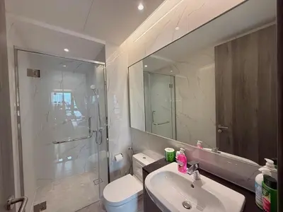 a bathroom with a sink and a toilet and a mirror at 2PX Comfy Suite, Agile Bukit Bintang Near TRX, Pavilion, MRT TRX in Kuala Lumpur