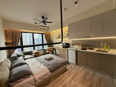 a kitchen with a large bed in a room at 2PX Comfy Suite, Agile Bukit Bintang Near TRX, Pavilion, MRT TRX in Kuala Lumpur