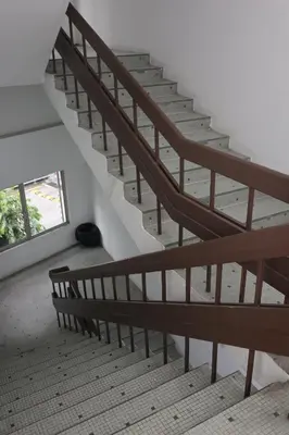 a set of stairs in a building with a window at Haven Hotel Pudu in Kuala Lumpur