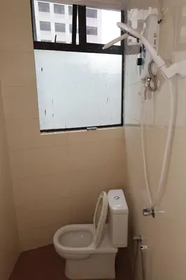 a bathroom with a toilet and a shower at Haven Hotel Pudu in Kuala Lumpur