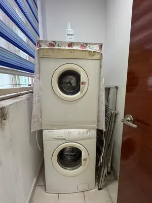 a washer and dryer in a small room at KLCC Marc Residence by Sadz in Kuala Lumpur