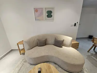 a living room with a couch and a coffee table at City Haven Bukit Bintang,KLCC,Pavillion in Kuala Lumpur