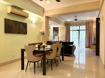 a dining room with a table and chairs and a piano at 183 Ampang KLCC by Widebed in Kuala Lumpur