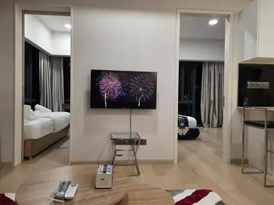 a living room with a tv on a wall at KL Star Residance KLCC by Nexus 111 in Kuala Lumpur