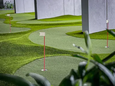 a rendering of a golf course with a putting green at Opus Residences KL by PILLOWTALKS in Kuala Lumpur