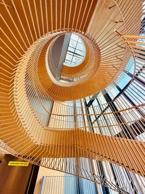 a spiral staircase in a building with a glass ceiling at One Bedroom Apartment Lucentia Residence in Kuala Lumpur