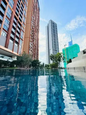 a pool of water in a city with tall buildings at One Bedroom Apartment Lucentia Residence in Kuala Lumpur