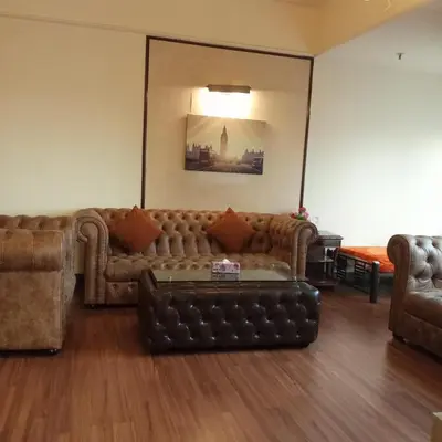 a living room with a couch and a table at Krish Apartment At Times Square in Kuala Lumpur