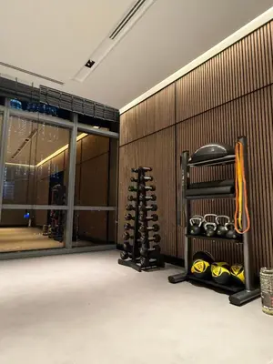 a gym room with a rack of boxing equipment at So Sofitel KL Residences in Kuala Lumpur