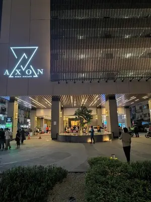 a lobby of a building with people walking around at The Excellent Axon Residence Bukit Bintang KL in Kuala Lumpur