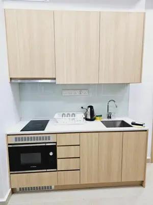 a kitchen with a stove and a sink at Grand infinitum suites KLCC by PN in Kuala Lumpur