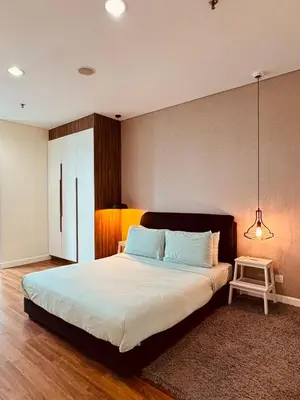 a bedroom with a large bed and a pendant light at 2 Bedroom Apartment Near KLCC 5 minutes Walk in Kuala Lumpur