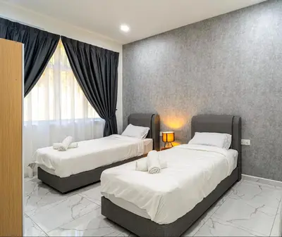 a bedroom with two beds and a window at Seputeh 2Sty House - 10 min to MidValley KL Gateway Bangsar in Kuala Lumpur